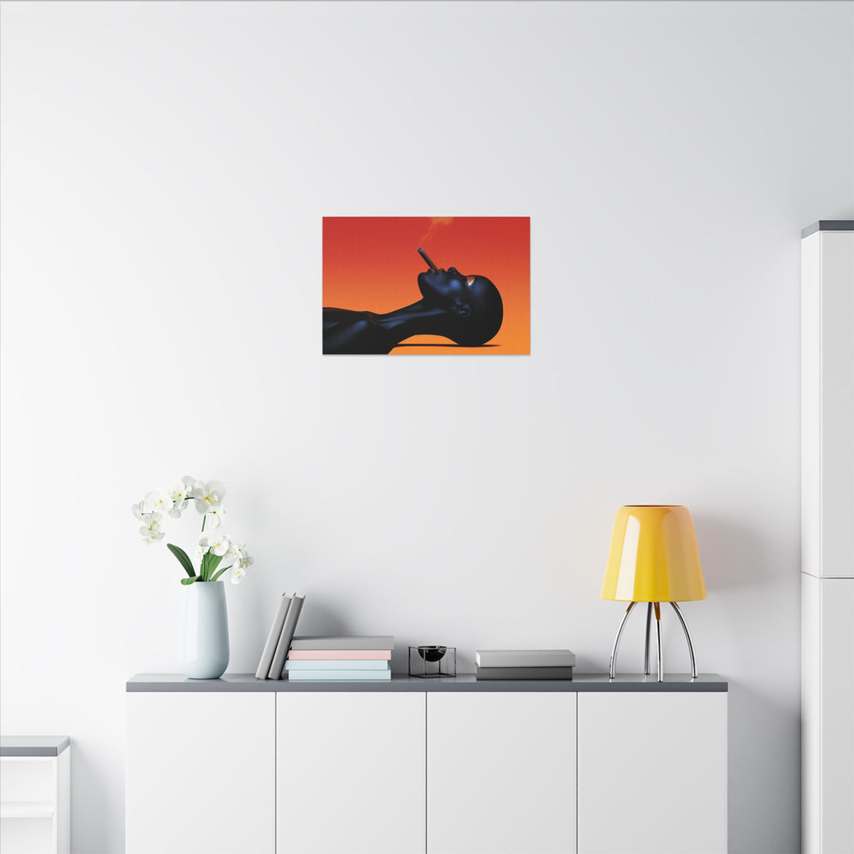 Smooth Operator canvas above a white sideboard with a yellow lamp and white flowers