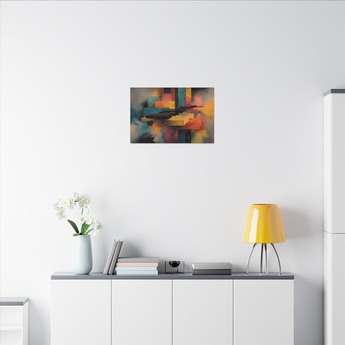 Piano Keyz canvas in a smaller size above a white sideboard with orchids