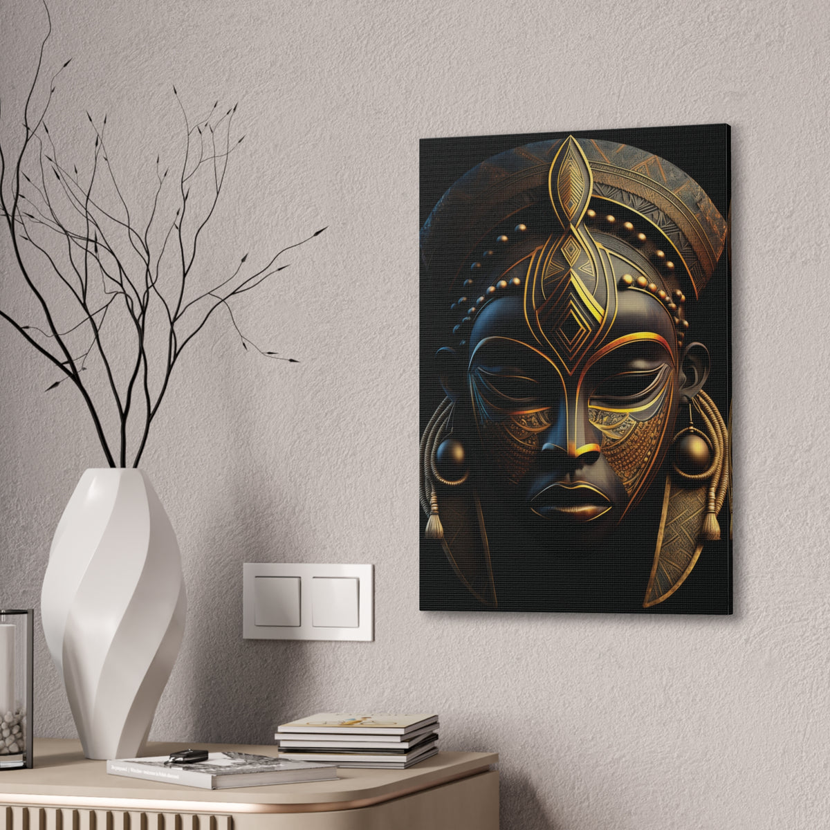 Black & Gold Mask canvas on a pale wall above a console with a white vase and bare branches