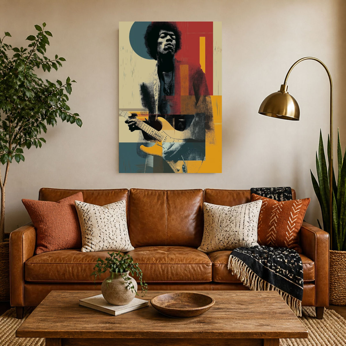 Jimi James canvas above a cognac leather sofa beside a brass floor lamp